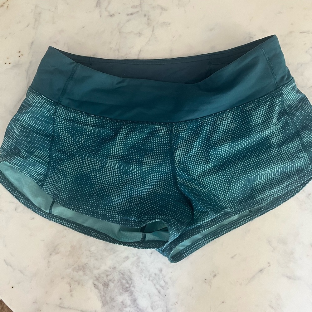Size 4 2.5 inch speed up shorts. GUC but logo faded off